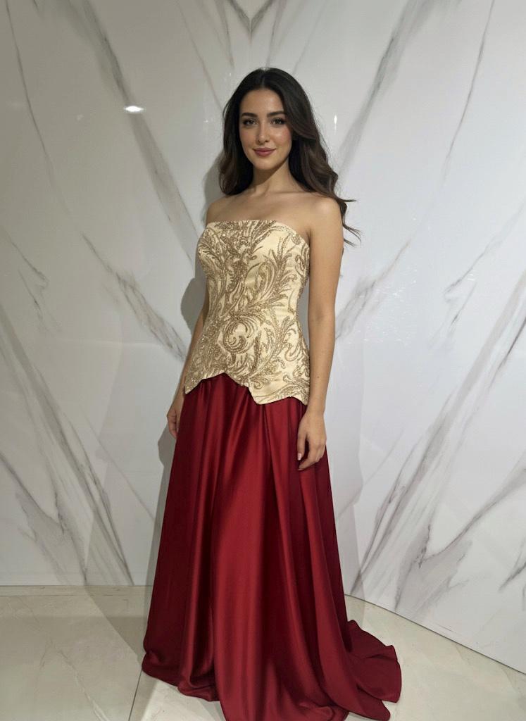 Gold-embroidered bodice with a deep red satin skirt