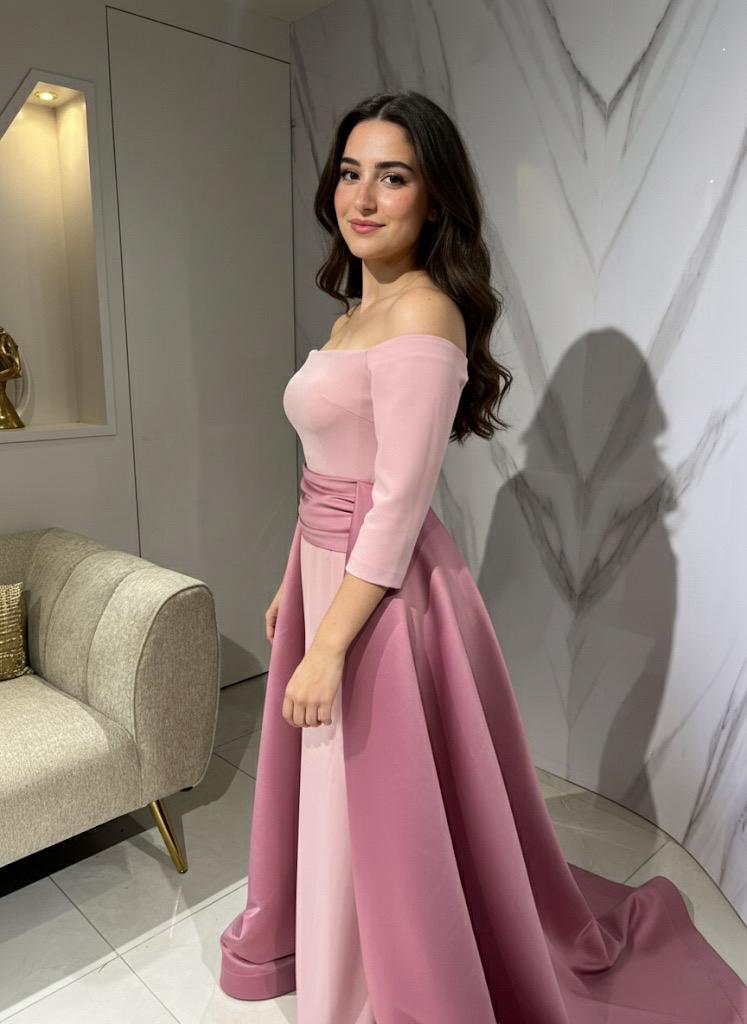 Blush pink off-shoulder gown with a full overskirt and train